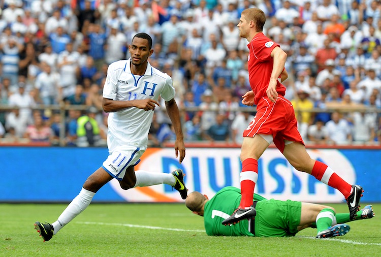 FBL-WC2014-QUALIFIERS-HON-CAN Jerry Bengtson (L) begins his celebration after scoring one of his three goals against Canada on Tuesday in World Cup 2014 qualifying in San Pedro Sula, Honduras. Honduras crushed Canada 8–1 eliminating the Canadians from World Cup qualification. (Orlando Sierra/AFP/Getty Images)