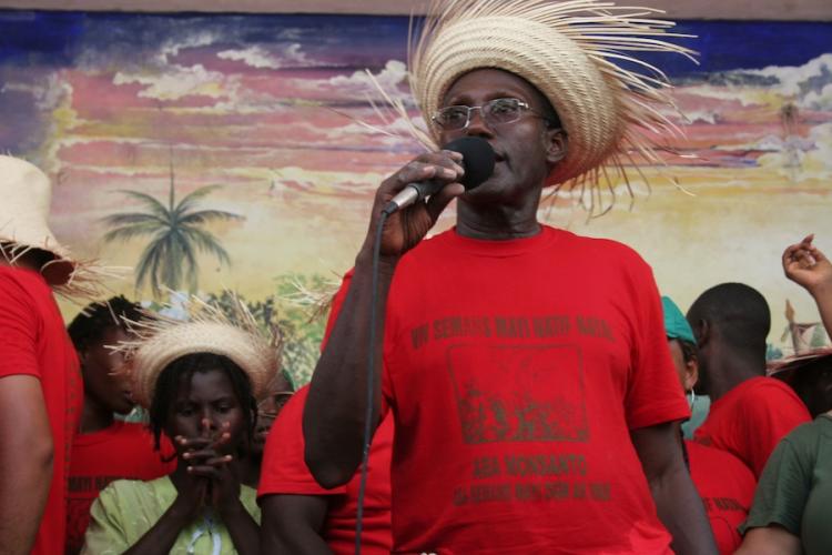 Jean Baptise Chavannes, leader of the MPP movement. His shirt says, in Creole, 'long live local corn, down with Monsanto, down with genetically modified and hybrid seeds.' (Alice Speri/Getty Images ) Jean Baptise Chavannes, leader of the MPP movement. His shirt says, in Creole, 'long live local corn, down with Monsanto, down with genetically modified and hybrid seeds.' (Alice Speri/Getty Images )
