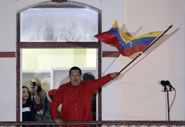 Venezuelan President Hugo Chavez waves a Venezuelan flag while speaking to supporters after receiving news of his reelection in Caracas on October 7, 2012. According to the National Electoral Council, Chavez was reelected with 54.42% of the votes, beating opposition candidate Henrique Capriles, who obtained 44.97%. (Juan Barreto/AFP/GettyImages) Venezuelan President Hugo Chavez waves a Venezuelan flag while speaking to supporters after receiving news of his reelection in Caracas on October 7, 2012. According to the National Electoral Council, Chavez was reelected with 54.42% of the votes, beating opposition candidate Henrique Capriles, who obtained 44.97%. (Juan Barreto/AFP/GettyImages)