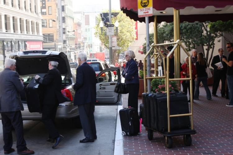 A San Francisco Hyatt Regency worker loads a cab with hotel guests' suitcases. Workers at Hyatt Regency in San Francisco went on strike early Tuesday morning to protest increased workloads. (Ivailo Anguelov/Epoch Times) A San Francisco Hyatt Regency worker loads a cab with hotel guests' suitcases. Workers at Hyatt Regency in San Francisco went on strike early Tuesday morning to protest increased workloads. (Ivailo Anguelov/Epoch Times)