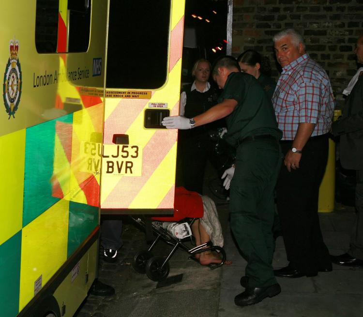 Amy Winehouse is escorted out of home in a wheelchair by paramedics after a 999 call made by her father, Mitch Winehouse. (ISOIMAGES.COM) Amy Winehouse is escorted out of home in a wheelchair by paramedics after a 999 call made by her father, Mitch Winehouse. (ISOIMAGES.COM)