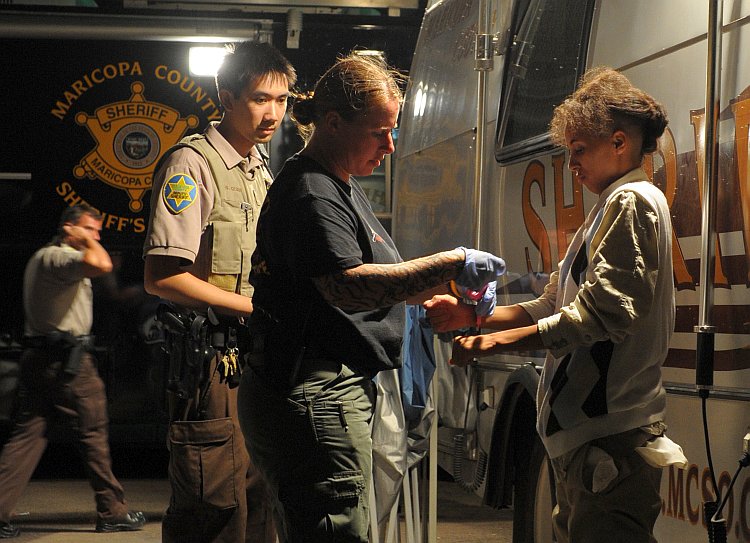 An illegal immigrant is processed by She Epoch Times Photo