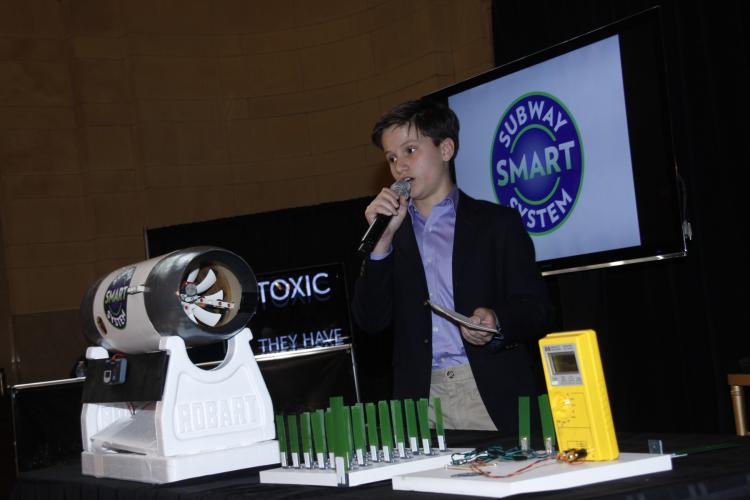 YOUNG INVENTORS: Spokesman and seventh-grader James Savoldelli, from the Horace Mann School, in the Bronx, speaks on the concept of harnessing wind energy to generate electricity Thursday at the student eco-panel presentation for Earth Day celebration. The Subway Smart System team is the regional winner of the 2011 ExploraVision Program. (Shi Lixin/The Epoch Times ) YOUNG INVENTORS: Spokesman and seventh-grader James Savoldelli, from the Horace Mann School, in the Bronx, speaks on the concept of harnessing wind energy to generate electricity Thursday at the student eco-panel presentation for Earth Day celebration. The Subway Smart System team is the regional winner of the 2011 ExploraVision Program. (Shi Lixin/The Epoch Times )