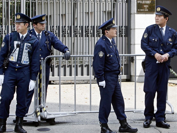 JapanEmbassy52640834 Policemen stand guard in front of the Chinese Embassy in Tokyo