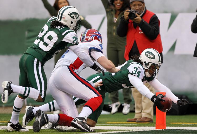 New York's Marquice Cole stretches to get in the end zone after picking off Buffalo quarterback Brian Brohm. (Al Bello/Getty Images) New York's Marquice Cole stretches to get in the end zone after picking off Buffalo quarterback Brian Brohm. (Al Bello/Getty Images)