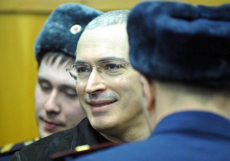 CORRUPT TRIAL? Mikhail Khodorkovsky (C) stands between police officers at a courtroom in Moscow on Monday. (Alexandaer Nemenov/AFP/Getty Images) CORRUPT TRIAL? Mikhail Khodorkovsky (C) stands between police officers at a courtroom in Moscow on Monday. (Alexandaer Nemenov/AFP/Getty Images)