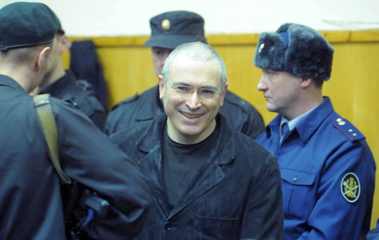 Former Yukos oil company CEO Mikhail Khodorkovsky (C) and his business partner Platon Lebedev (R) are seen in the defendants' cage just after a verdict during a court session in Moscow on Dec. 30. (Dmitry Kostyukov/AFP/Getty Images) Former Yukos oil company CEO Mikhail Khodorkovsky (C) and his business partner Platon Lebedev (R) are seen in the defendants' cage just after a verdict during a court session in Moscow on Dec. 30. (Dmitry Kostyukov/AFP/Getty Images)