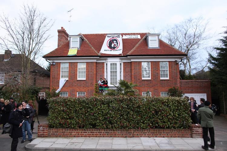 COMMANDEERED: Squatters demonstrate outside the London house of Saif al-Islam Gadhafi, Moammar Gadhafi's son, on March 9. Libyan squatters have taken control of the $17 million house on behalf of the Libyan people, they say. (Oli Scarff/Getty Images) COMMANDEERED: Squatters demonstrate outside the London house of Saif al-Islam Gadhafi, Moammar Gadhafi's son, on March 9. Libyan squatters have taken control of the $17 million house on behalf of the Libyan people, they say. (Oli Scarff/Getty Images)