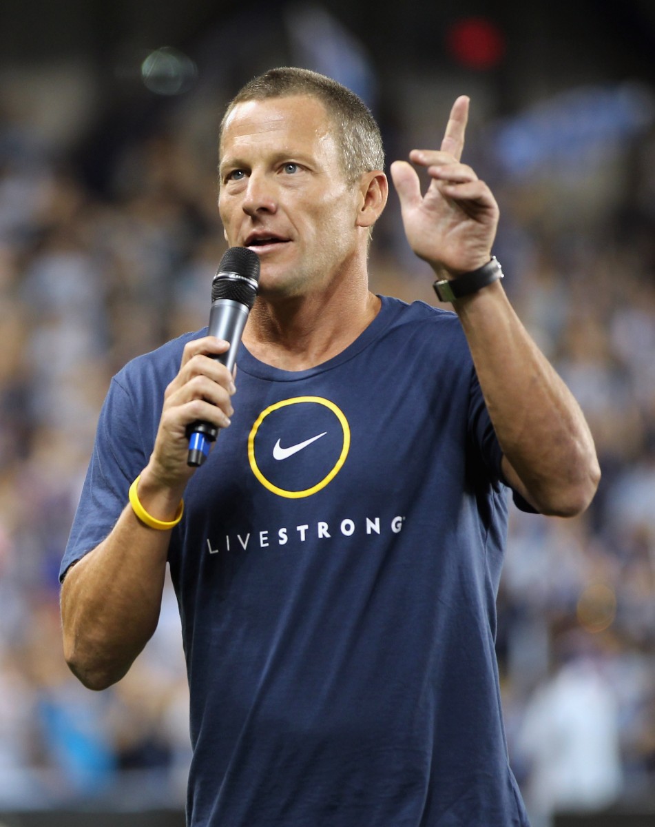 Lance Armstrong addresses the crowd prior to the first soccer game at Livestrong Sporting Park in Kansas City on June 9, 2011. Armstrong stepped down as chairman of his Livestrong cancer-fighting charity on Wednesday and sponsors Nike and Anheuser-Busch cut ties with the cyclist after the U.S. Anti-Doping Agency released details of Armstrong's long-time involvement in doping last week. (Jamie Squire/Getty Images) 