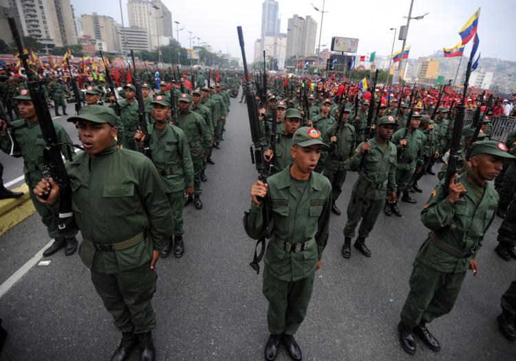 Venezuelan dictator Hugo Chavez swears in members of the Bolivarian militia on the country's first 'National Bolivarian Militia of the People in Arms' and the April Revolution's Day,' which he declared as a day of national joy. (Juan Barreto/AFP/Getty Images) Venezuelan dictator Hugo Chavez swears in members of the Bolivarian militia on the country's first 'National Bolivarian Militia of the People in Arms' and the April Revolution's Day,' which he declared as a day of national joy. (Juan Barreto/AFP/Getty Images)