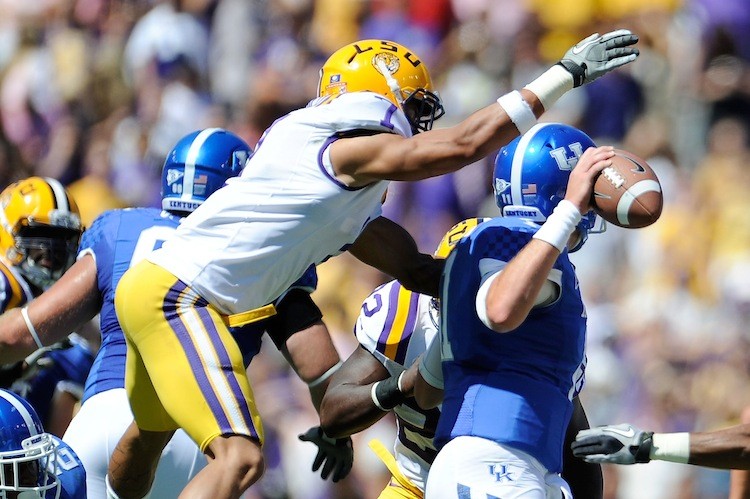LSU cornerback Tyrann Mathieu strips the ball from Kentucky quarterback Maxwell Smith on October 1st. The top-ranked Tigers won 35-7 and are currently 7-0. (Stacy Revere/Getty Images) LSU cornerback Tyrann Mathieu strips the ball from Kentucky quarterback Maxwell Smith on October 1st. The top-ranked Tigers won 35-7 and are currently 7-0. (Stacy Revere/Getty Images)