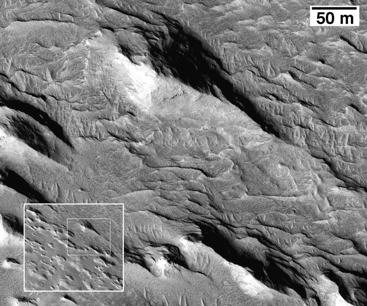 Wind-eroded yardangs composed of materials from the lower member of the Medusae Fossae Formation. (Image courtesy of NASA/JPL/University of Arizona) Wind-eroded yardangs composed of materials from the lower member of the Medusae Fossae Formation. (Image courtesy of NASA/JPL/University of Arizona)