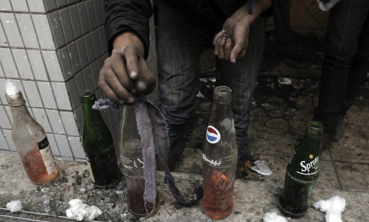 An Egyptian protester prepares a Molotov cocktail bomb in Cairo on November 23, 2011. (Mahmud Hamsa/AFP/Getty Images) 