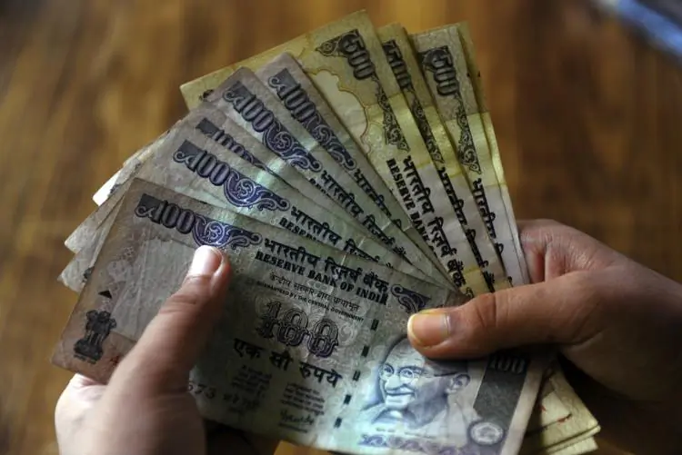 Indian rupee notes at a bank in Kolkata on July 15. India unveiled a symbol for its rupee currency that it hopes will become as globally recognized as signs for the dollar, the yen, the pound and the euro.  (Deshakalan Chowdhury/Getty Images)
