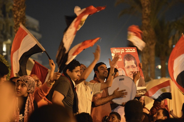 Egyptians celebrate Muslim Brotherhood candidate Mohamed Mursi's victory in Egypt's presidential elections in Cairo's Tahrir Square on June 24. (Khaled Desouki/AFP/GettyImages) Epoch Times Photo