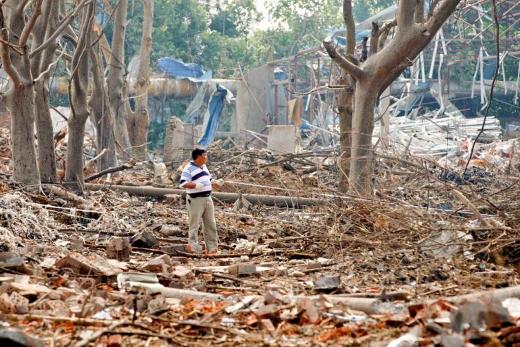 RUBBLE: A man stands among what's left of the buildings shattered by the explosion in Nanjing City, Jiangsu Province. (The Epoch Times) RUBBLE: A man stands among what's left of the buildings shattered by the explosion in Nanjing City, Jiangsu Province. (The Epoch Times)
