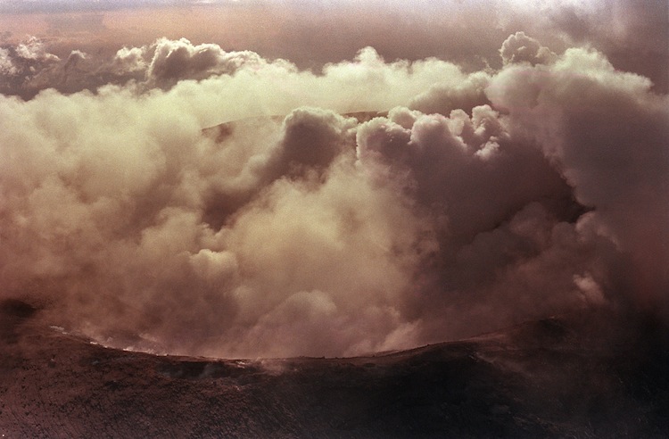 The crater of the volcano Nevado Del Ruiz smoulders November 17, 1985, 3 days after its eruption which destroyed the mountain town of Armero. Over 25 thousands of people died in that eruption. (Jonathan Utz/AFP/Getty Images) Epoch Times Photo