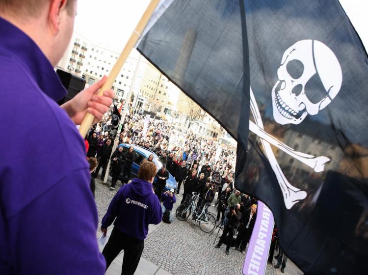 Supporters of the Pirate Bay Web site, one of the world's top illegal file-sharing Web sites, demonstrate in Stockholm on April 18, 2009. Sweden's tough new anti-piracy law has led to a sharp drop in illegal downloading. (Fredrik Persson/AFP/Getty Images) Supporters of the Pirate Bay Web site, one of the world's top illegal file-sharing Web sites, demonstrate in Stockholm on April 18, 2009. Sweden's tough new anti-piracy law has led to a sharp drop in illegal downloading. (Fredrik Persson/AFP/Getty Images)