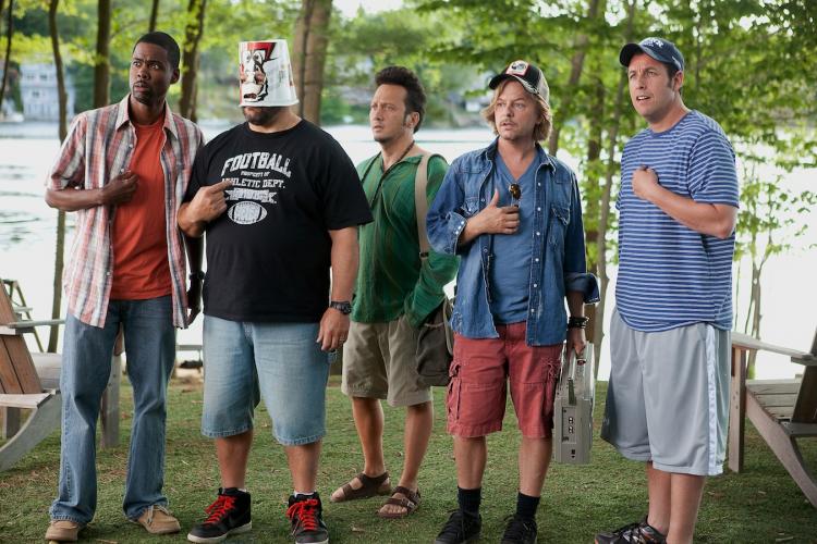 THE BOYS ARE BACK: Kurt (Chris Rock), Eric (Kevin James) with a bucket on his head, Rob (Rob Schneider), Marcus (David Spade), Lenny (Adam Sandler) in 'Grown Ups.' (Courtesy of Sony Pictures) THE BOYS ARE BACK: Kurt (Chris Rock), Eric (Kevin James) with a bucket on his head, Rob (Rob Schneider), Marcus (David Spade), Lenny (Adam Sandler) in 'Grown Ups.' (Courtesy of Sony Pictures)