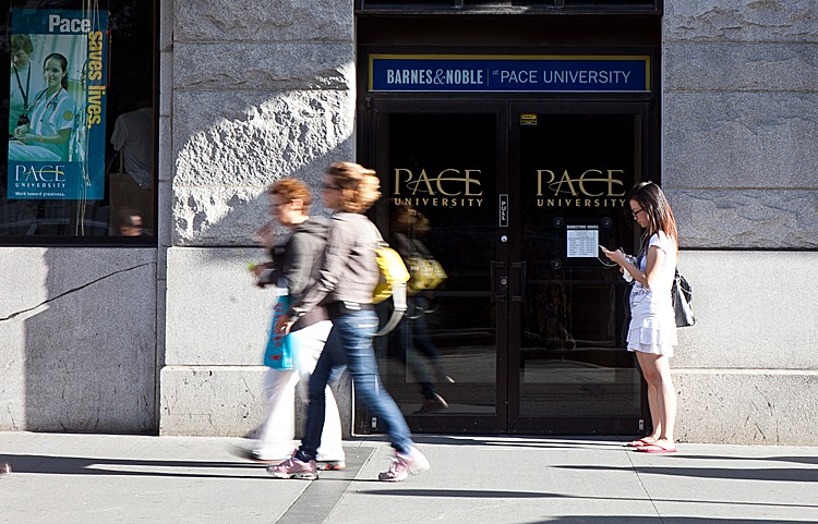 People walk past the Pace University in Manhattan. The associate-director at the Confucius Institute at Pace University said the Chinese regime has a 'right to ban' Falun Gong practitioners from volunteering at the Institute. (AMAL CHEN/THE EPOCH TIMES)