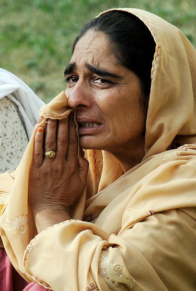 A Pakistani woman weeps for her injured relative after the suicide attack as she awaits for permission to visit him at the Pakistan Ordnance Factory hospital in Wah on Aug. 21. (Farooq Naeem/AFP/Getty Images) A Pakistani woman weeps for her injured relative after the suicide attack as she awaits for permission to visit him at the Pakistan Ordnance Factory hospital in Wah on Aug. 21. (Farooq Naeem/AFP/Getty Images)