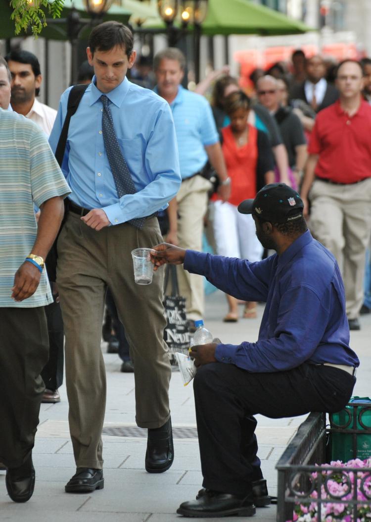 HOMELESS HELP: A panhandler in Washington, D.C., asks passersby for money. Some U.S. cities are installing 'giving meters' for people who wish to donate and help the homeless, but not give money directly. (MANDEL NGAN/AFP/Getty Images) HOMELESS HELP: A panhandler in Washington, D.C., asks passersby for money. Some U.S. cities are installing 'giving meters' for people who wish to donate and help the homeless, but not give money directly. (MANDEL NGAN/AFP/Getty Images)