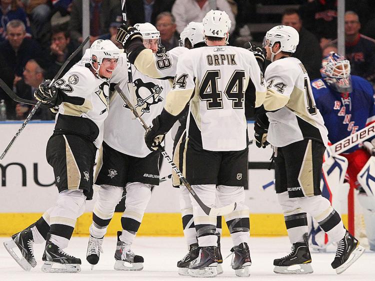 PENGUINS CELEBRATE: Sidney Crosby (far left) celebrates with teammates the goal scored by defenseman Kris Letang. (Chris McGrath/Getty Images) PENGUINS CELEBRATE: Sidney Crosby (far left) celebrates with teammates the goal scored by defenseman Kris Letang. (Chris McGrath/Getty Images)