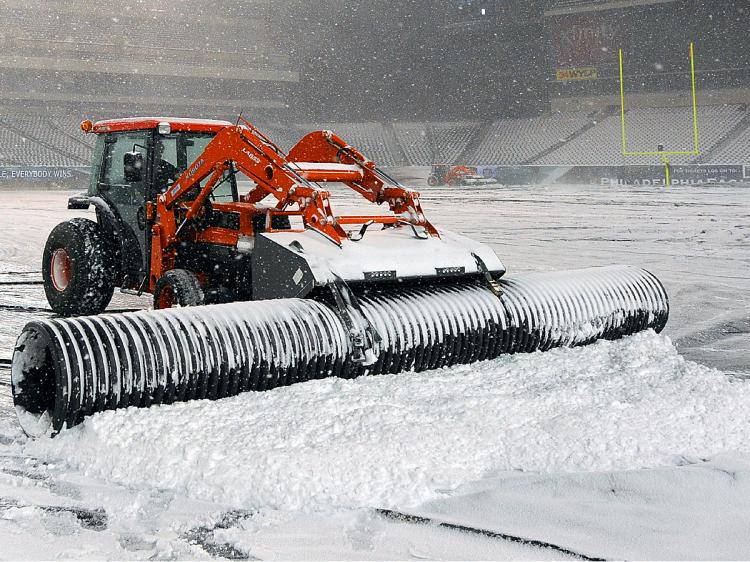 NO GAME: A plow works to remove snow from the playing surface at Lincoln Financial Field on Dec, 26, 2010 in Philadelphia, Pennsylvania. (Drew Hallowell/Getty Images) NO GAME: A plow works to remove snow from the playing surface at Lincoln Financial Field on Dec, 26, 2010 in Philadelphia, Pennsylvania. (Drew Hallowell/Getty Images)