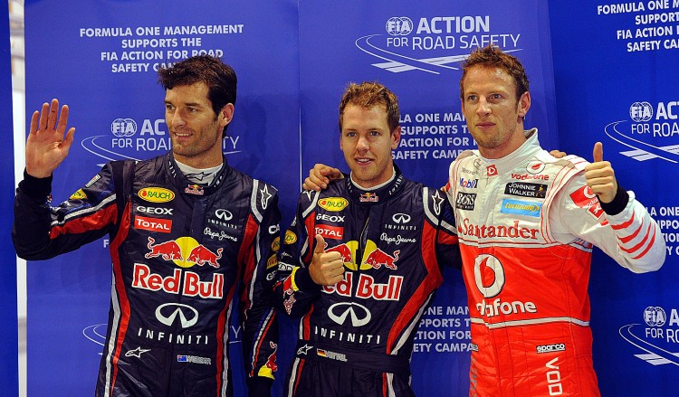 Red Bull-Renault driver Sebastian Vettel (C), teammate Mark Webber (L) and McLaren-Mercedes driver Jenson Button (R) celebrate success in qualifying for the F1 Singapore Grand Prix. (Prakash Singh/AFP/Getty Images) Red Bull-Renault driver Sebastian Vettel (C), teammate Mark Webber (L) and McLaren-Mercedes driver Jenson Button (R) celebrate success in qualifying for the F1 Singapore Grand Prix. (Prakash Singh/AFP/Getty Images)