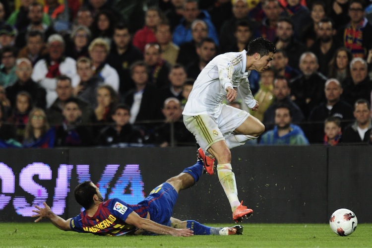Real Madrid's Portuguese forward Cristia Real Madrid's Cristiano Ronaldo evades Barcelona's Javier Mascherano in the 'El Clasico' matchup at the Camp Nou in Barcelona on Saturday. (Javier Soriano/AFP/Getty Images)
