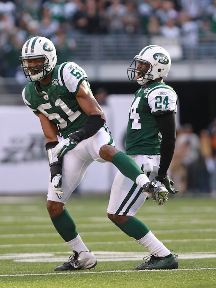 Jets' defensive players Aaron Maybin (51) and Darrelle Revis (24) celebrate Revis' fourth quarter interception against San Diego. (Nick Laham/Getty Images) Jets' defensive players Aaron Maybin (51) and Darrelle Revis (24) celebrate Revis' fourth quarter interception against San Diego. (Nick Laham/Getty Images)