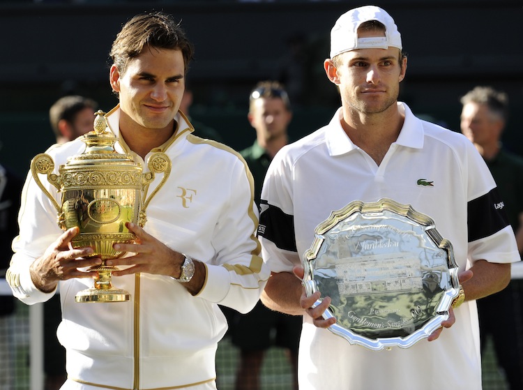 Switzerland's Roger Federer (L) holds th Switzerland's Roger Federer (L) holds th