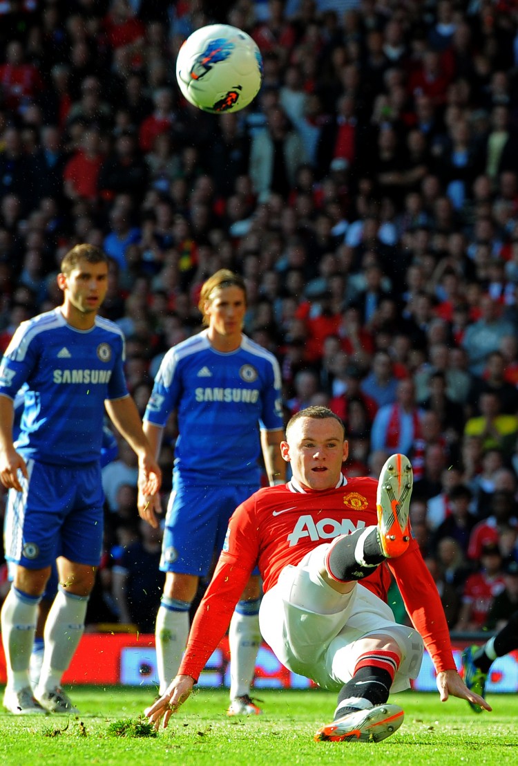 Manchester United's Wayne Rooney slips as he takes a penalty on Sunday against Chelsea. (ANDREW YATES/AFP/Getty Images) Manchester United's Wayne Rooney slips as he takes a penalty on Sunday against Chelsea. (ANDREW YATES/AFP/Getty Images)