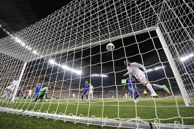 English forward Wayne Rooney (R) scores England's Wayne Rooney heads home the game's only goal against Ukraine on Tuesday night. (Carl de Souza/AFP/GettyImages)