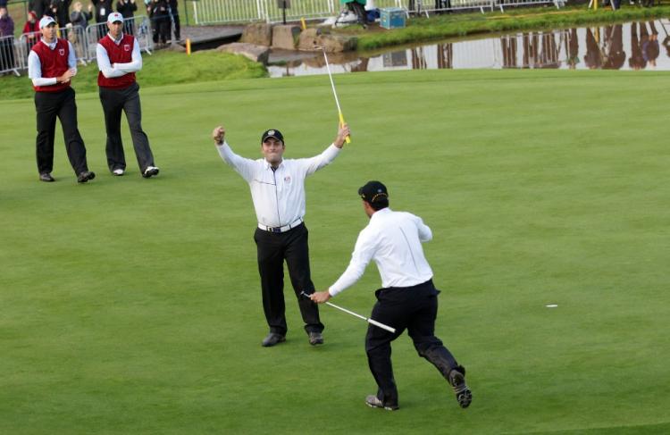 Europeans Francesco Molinari and Edoardo Molinari (R) celebrate during the Fourball & Foursome Matches at the Ryder Cup. (Andrew Redington/Getty Images )