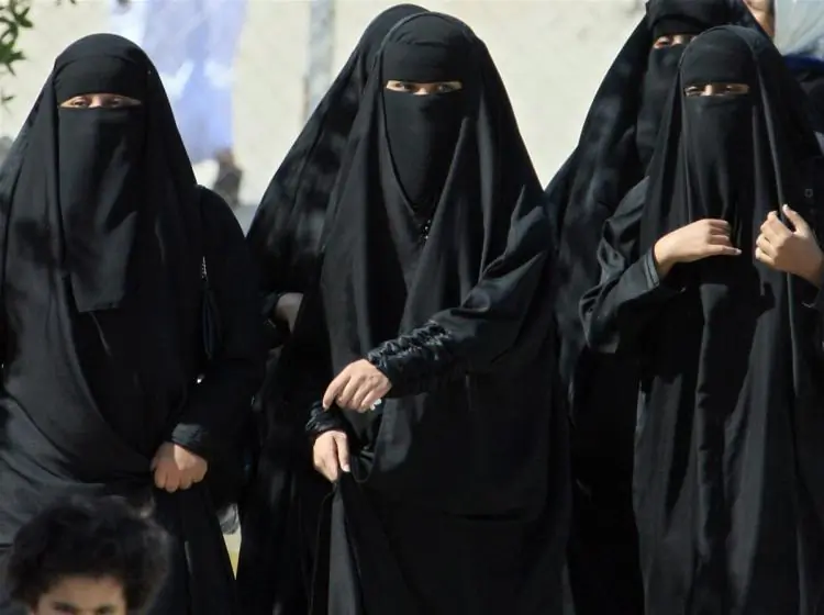 Saudi women cross a street in Hofuf, Saudi Arabia, on Nov. 22, 2007. (Hassan Ammar/AFP/Getty Images)
