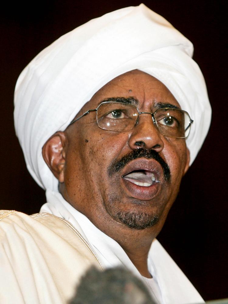 GENOCIDE CHARGES: Sudanese President Omar al-Bashir gives a speech during in Parliament in Khartoum, Sudan, on May 27. On Monday, al-Bashir was charged with genocide by the International Criminal Court. (Ashraf Shazly/Getty Images) GENOCIDE CHARGES: Sudanese President Omar al-Bashir gives a speech during in Parliament in Khartoum, Sudan, on May 27. On Monday, al-Bashir was charged with genocide by the International Criminal Court. (Ashraf Shazly/Getty Images)