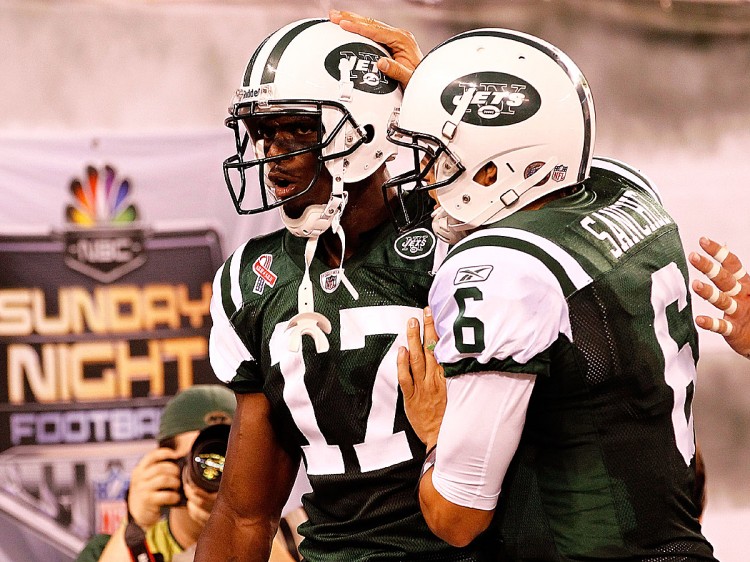 Jets quarterback Mark Sanchez congratulates Plaxico Burress on his first regular-season TD catch since November 2008. Burress, now 34, is a major part of the new-look receiving group for Rex Ryan's crew. (Jeff Zelevansky/Getty Images) Jets quarterback Mark Sanchez congratulates Plaxico Burress on his first regular-season TD catch since November 2008. Burress, now 34, is a major part of the new-look receiving group for Rex Ryan's crew. (Jeff Zelevansky/Getty Images)