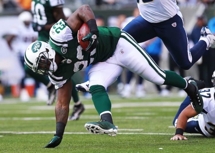 Shonn Greene (23) stays on his feet after shedding a pair of tacklers on his way to a season-high 112 yards. His performance was a big part of the Jets' 27-21 comeback win over San Diego. (Nick Laham/Getty Images) Shonn Greene (23) stays on his feet after shedding a pair of tacklers on his way to a season-high 112 yards. His performance was a big part of the Jets' 27-21 comeback win over San Diego. (Nick Laham/Getty Images)