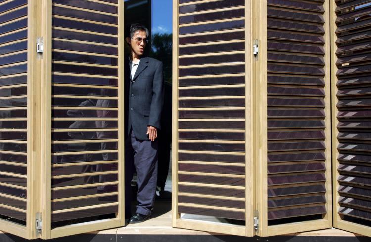 HOME OF THE FUTURE: Somchai Paarporn takes a look at movable shades of solar panels as he visits a home built by the Technische Universitat Darmstadt in Germany during the 2007 Solar Decathlon on in Washington, D.C. (SAUL LOEB/AFP/Getty Images) HOME OF THE FUTURE: Somchai Paarporn takes a look at movable shades of solar panels as he visits a home built by the Technische Universitat Darmstadt in Germany during the 2007 Solar Decathlon on in Washington, D.C. (SAUL LOEB/AFP/Getty Images)