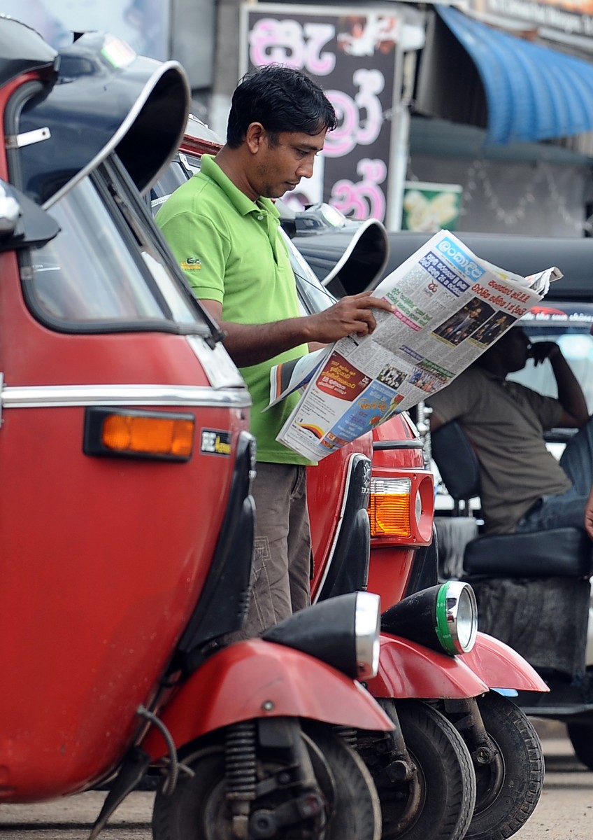 Sri Lanka A Sri Lankan man reads a local newspaper in the capital Colombo on Sept. 17, 2012. (Lakruwan Wanniarachchi/AFP/GettyImages)