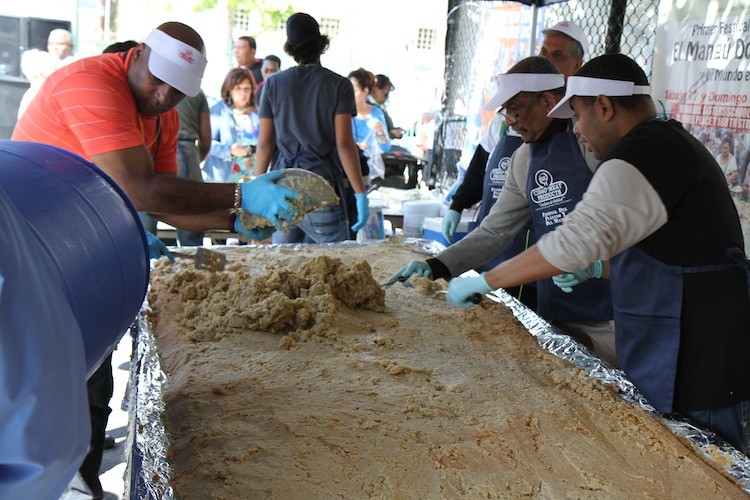 A dish of mangu, a traditional recipe of mashed plantains, is prepared by workers at the Plantain Festival, in Washington Heights on Sunday. (Zack Stieber/The Epoch Times) A dish of mangu, a traditional recipe of mashed plantains, is prepared by workers at the Plantain Festival, in Washington Heights on Sunday. (Zack Stieber/The Epoch Times)