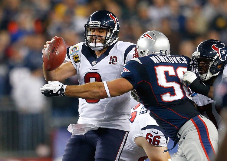 Houston Texans quarterback Matt Schaub is pressured by New England Patriots linebacker Rob Ninkovich. Schaub and the Texans had a game to forget in Foxborough, Mass. on Monday. (Jim Rogash/Getty Images) 