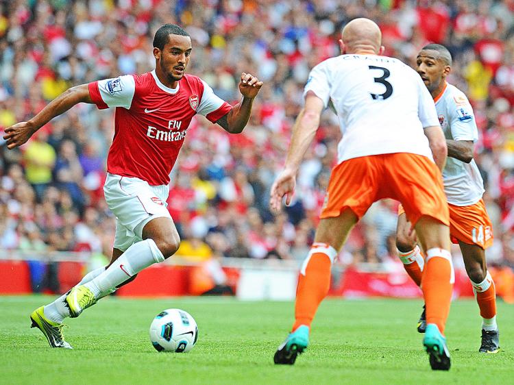 Arsenal's English striker Theo Walcott (L), scorer of three of Arsenal's six goals in action during the English Premier League football match between Arsenal and Blackpool at the Emirates Stadium in London, England. (Carl De Souza/AFP/Getty Images) Arsenal's English striker Theo Walcott (L), scorer of three of Arsenal's six goals in action during the English Premier League football match between Arsenal and Blackpool at the Emirates Stadium in London, England. (Carl De Souza/AFP/Getty Images)