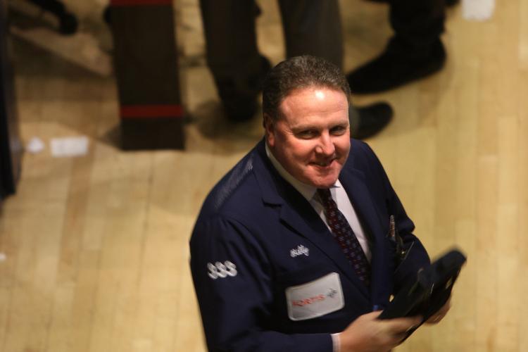 A trader is seen working on the floor of the New York Stock Exchange. Stocks finished in the positive for the fifth straight session on Friday. (Spencer Platt/Getty Images) A trader is seen working on the floor of the New York Stock Exchange. Stocks finished in the positive for the fifth straight session on Friday. (Spencer Platt/Getty Images)