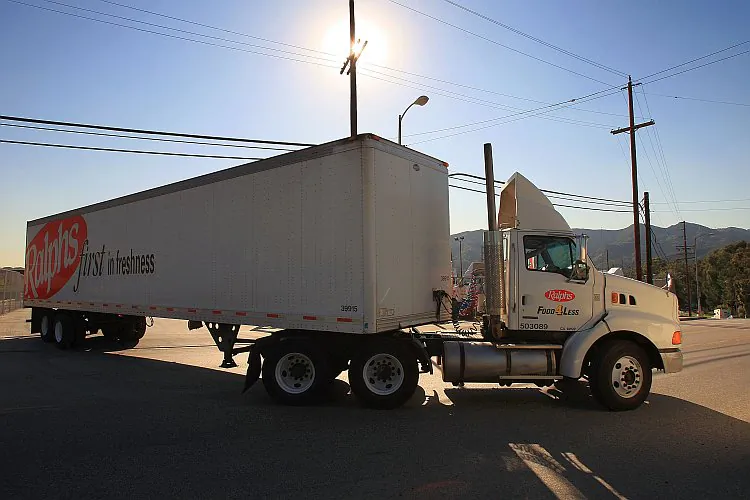 A truck leaves a trucking facility in Glendale, Calif., in this file photo. Small trucking companies are concerned they may be negatively impacted by the crackdown on independent contractor misclassifications. (David McNew/Getty Images) 