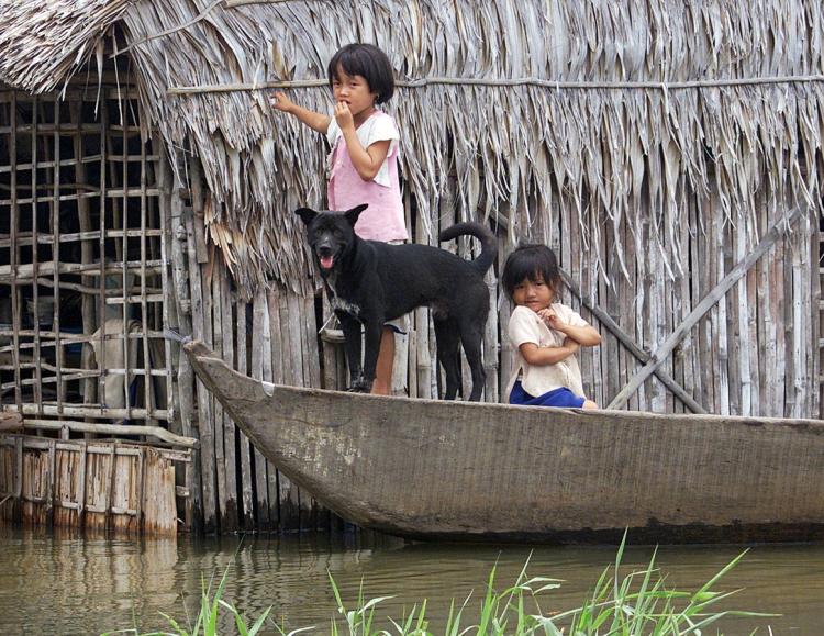 Two young girls take a boat out on their own in Long An Province, in South Vietnam. Every year, up to 350,000 children drown in Asia. The Australian government is funding the establishment of the International Drowning Research Center aimed at reducing ch (Hoang Dinh Nam/AFP/Getty Images) Two young girls take a boat out on their own in Long An Province, in South Vietnam. Every year, up to 350,000 children drown in Asia. The Australian government is funding the establishment of the International Drowning Research Center aimed at reducing ch (Hoang Dinh Nam/AFP/Getty Images)