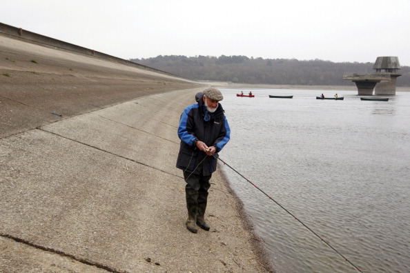 A fisherman casts his line into the water. (Justin Tallis/AFP/Getty Images) A fisherman casts his line into the water. (Justin Tallis/AFP/Getty Images)