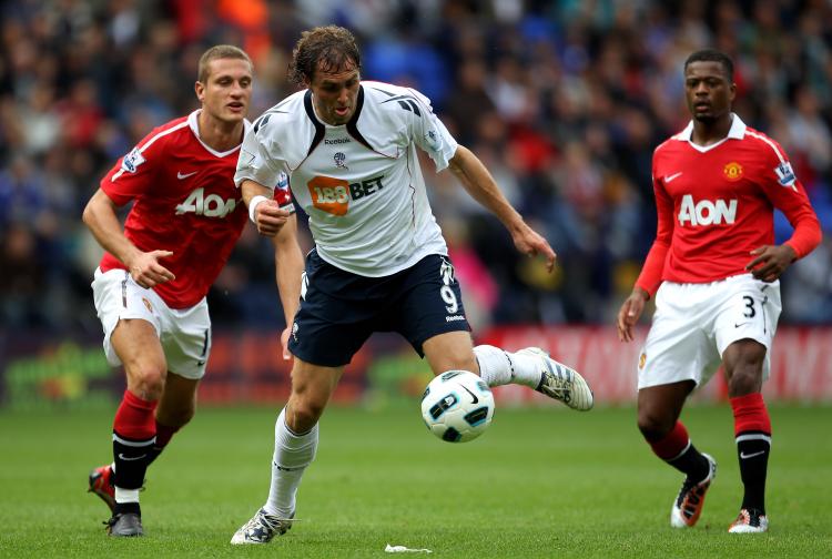 DEFENSIVE ISSUES: Bolton's Johan Elmander gets by Manchester United's porous defense. (Alex Livesey/Getty Images) DEFENSIVE ISSUES: Bolton's Johan Elmander gets by Manchester United's porous defense. (Alex Livesey/Getty Images)