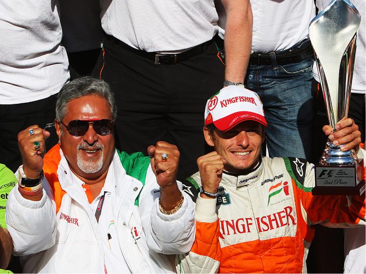 Giancarlo Fisichella and Force India team owner Dr Vijay Mallya celebrate Fisischella's second-place finish in the Belgian Grand Prix, August 30, 2009. (Mark Thompson/Getty Images) Giancarlo Fisichella and Force India team owner Dr Vijay Mallya celebrate Fisischella's second-place finish in the Belgian Grand Prix, August 30, 2009. (Mark Thompson/Getty Images)